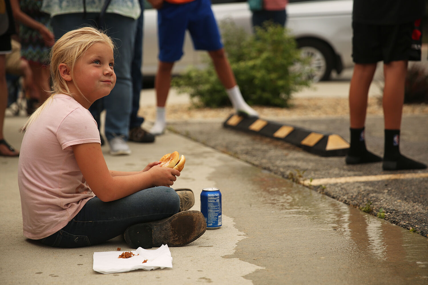 Oakley Garton, 6, eats her sandwich off a napkin while the dunk tank